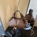 Minimalist dark brown cloud handbag in pebble leather with top handle and crossbody strap - Brown