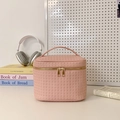 Pink woven leather makeup bag with gold double zippers and top handle for travel - Pink