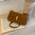Macro detail of brown suede crossbody bag with vintage gold metal twist lock buckle - Brown