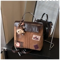 Detail of vintage brown dual-use backpack with cute patches and plush bear charm - With Charm / Brown