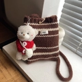Striped knit bucket bag in brown and beige with a teddy bear charm and wooden button - With Charm / Brown