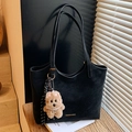 Large black matte leather tote bag with shoulder straps and plush puppy charm - Black with Pendant