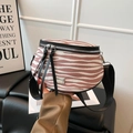 Pink and white animal print crossbody bag with wide black strap and silver zipper - Pink