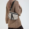 Crossbody chest bag featuring zebra print and a brown base with stylish fringe detail - Brown