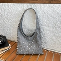 Grey suede hobo tote bag with silver metal rivets and minimalist bucket design - Gray