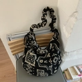 Detail of the pleated wide strap and retro black and white fleece on the hobo tote bag - Black Totem