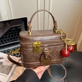 Vintage brown quilted box handbag featuring a cherry charm and gold hardware detail - With Charm / Brown