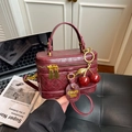 Vintage wine red quilted box bag with a cherry charm accessory and sturdy top handle - With Charm / Red