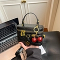 Vintage style black quilted leather vanity box handbag featuring a cute red cherry charm - With Charm / Black