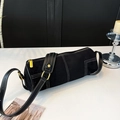Detail of black cylinder bag showing white contrast stitching and gold metal zipper - Black Solid