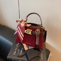 Chic burgundy square crossbody bag in matte finish with a silk scarf and gold hardware - Burgundy