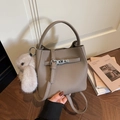 Taupe lychee grain bucket bag with metal buckle and plush rabbit charm detail - With Pendant / Khaki