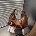 Dark brown crescent hobo bag with a sequined cherry charm and adjustable strap - With Charm / Brown