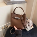 Deep brown pebble leather bucket bag with silver twist lock and plush rabbit charm - With Pendant / Brown
