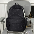 Black school backpack with star and moon print and MODAG lettering on a chair - No Pendant / Black
