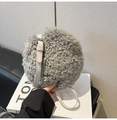 Detail of grey plush round bag showing soft curly texture and adjustable leather strap - Gray