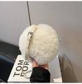 Detailed close-up of white fluffy lamb wool round crossbody bag with adjustable strap - White