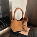 Brown bucket bag in matte textured faux leather with tassel and faux fur pompom charm - Brown with Pendant