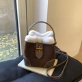 Brown suede bucket bag with white faux fur trim and gold metal twist lock - Brown
