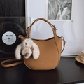 Brown lychee leather bucket bag with top handles and a cute plush rabbit charm - Brown with Pendant