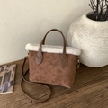 Brown faux suede plush bucket bag with monogram embossing and white faux fur trim - Brown