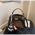 Detailed shot of vintage brown suede and black leather stitching with metal buckle - Green with Pendant