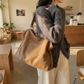 Brown faux leather tote bag with Maodi flower print and drawstring detail on shoulder - Brown