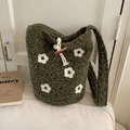 Dark green knitted bucket bag with white crochet flower patterns and horn toggle closure - Green