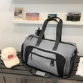 Large gray and black sports travel bag with adjustable padded shoulder strap and side pockets - Gray