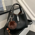 Chic black bucket bag with silver hardware and a brown faux fur pompom charm - Black with Pendant