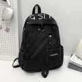 Sac à dos en denim noir délavé avec fermetures éclair diagonales et broderies - Noir