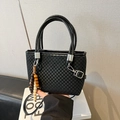 Chic black checkered tote bag with wooden bead pendant and polished leather handles - Black