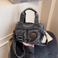 Retro washed denim crossbody bag in black featuring multiple front pockets and top handle - Black
