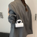 Mini white acrylic cylindrical crossbody bag with gold chain strap and wave handle - White