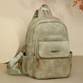 Minimalist grey-green multi-purpose travel backpack with matte leather texture - Green