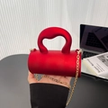 Matte red acrylic cylinder bag with gold chain strap and bold curved handle for women - Red