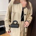 Mini sac cylindrique noir avec poignée en cœur et bandoulière chaîne dorée - Noir