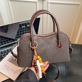 Dark brown woven texture handbag with top handles and decorative beaded tassel charm - Brown