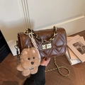 Brown quilted crossbody bag with gold chain strap and cute plush dog charm - With Charm / Brown