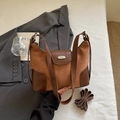 Brown vintage dumpling shoulder bag in premium suede and smooth leather finish - No Charm Style / Brown