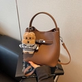 Brown litchi grain bucket bag with silver lock and a cute teddy dog plush pendant - Brown with Pendant