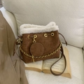 Dark brown suede bucket bag with white faux fur trim and elegant gold chain detail - Brown