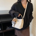 White lychee leather bucket bag with silver lock, long strap and cute brown bear charm - Cream White With Pendant