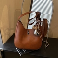 Brown vintage faux leather shoulder bag featuring a silver twist lock and leopard bow - Yellowish Brown With Pendant