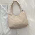 Minimalist beige canvas tote bag with curved half-moon design and black brand label - No Pendant / Off White
