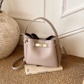 Litchi pattern leather bucket bag in light coffee finish with gold twist lock - No Pendant / Mauve Grey