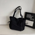 Borsa tote nera in tela con tasca frontale a zip e scomparti laterali con coulisse - Nero