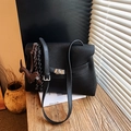 Black pebbled leather Kelly bag with silver buckle and puppy charm decoration - With Charm / Black