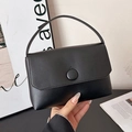 Minimalist black leather square handbag with top handle and round buckle detail - Black