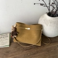 Large mustard yellow tote bag with metal lock and cute bear charm in a cozy setting - Caramel (With Charm)